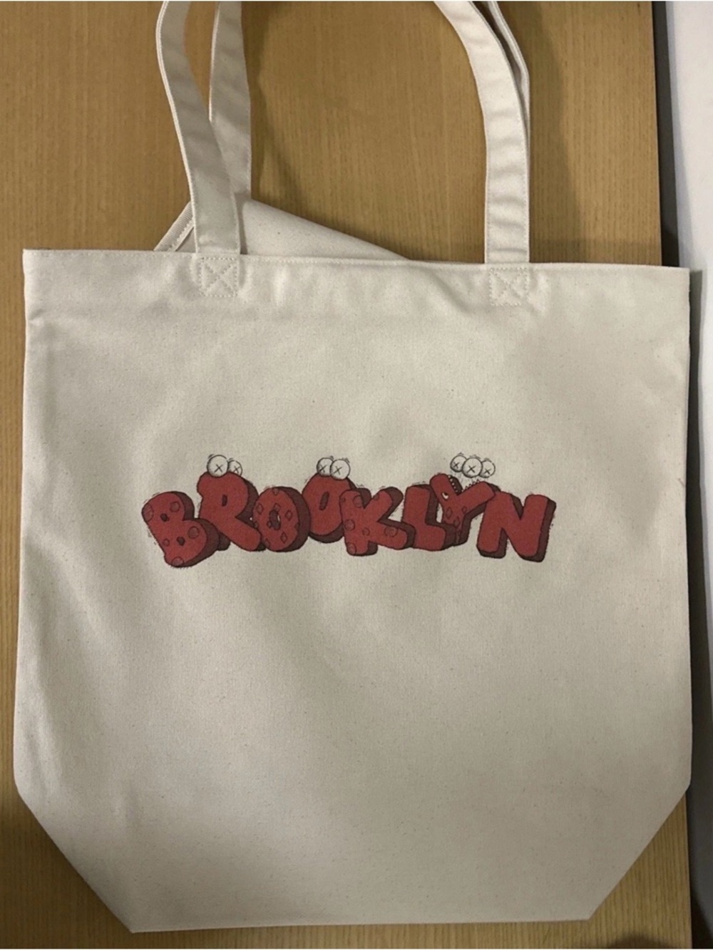 Uniqlox Kaws- Brooklyn Graphic Canvas Tote Bag - White with Red Print